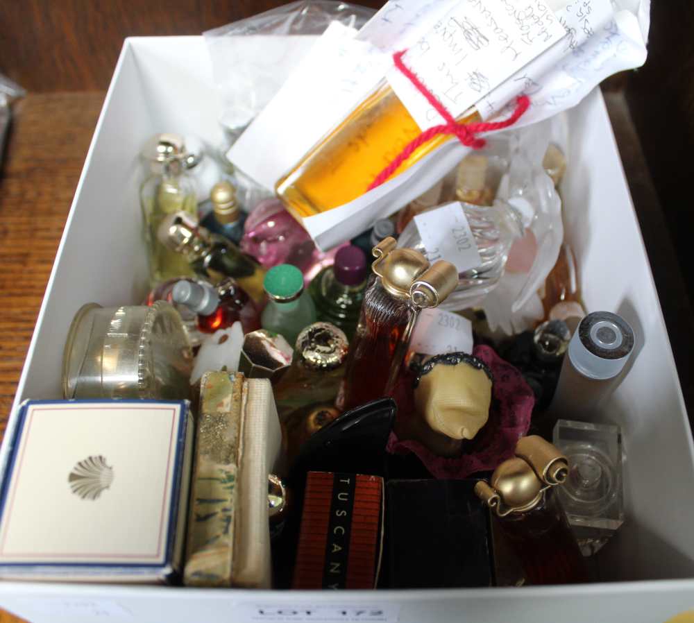 A box containing a selection of miniature modern and vintage perfumes