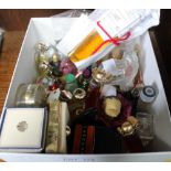 A box containing a selection of miniature modern and vintage perfumes