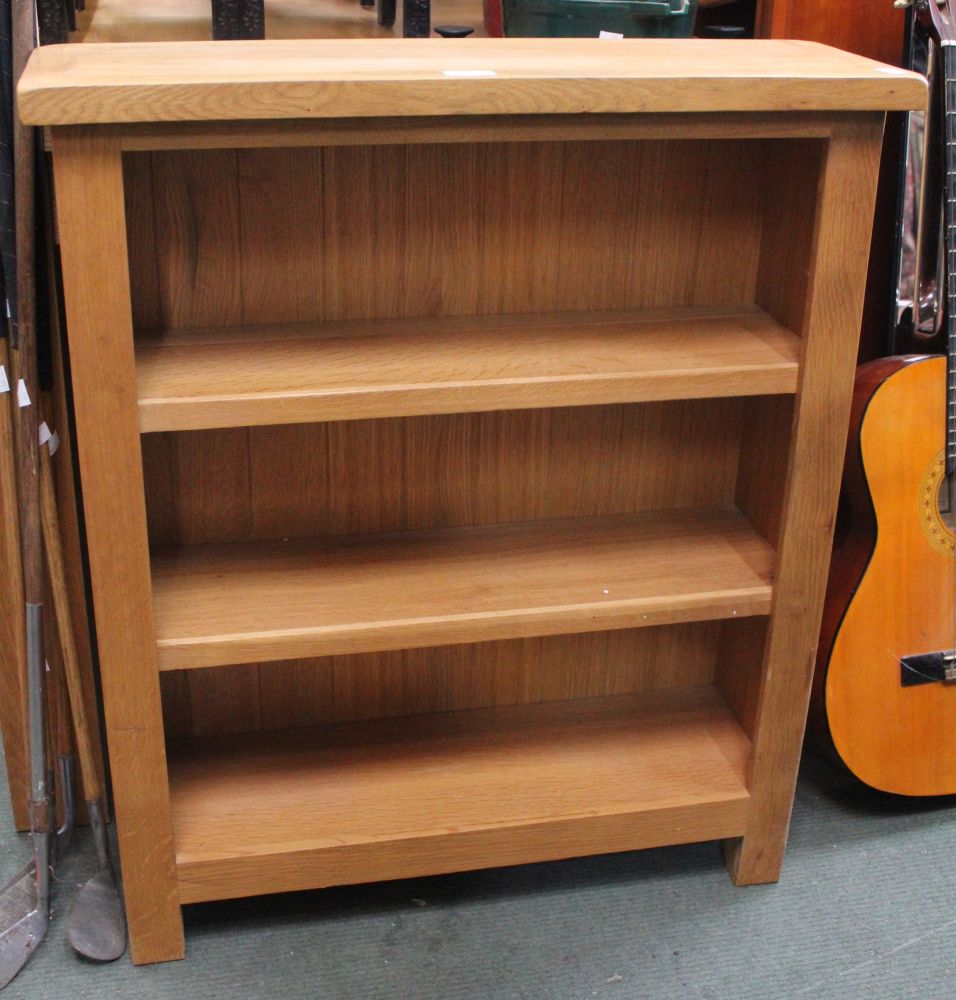 A modern beech three shelf bookcase