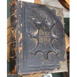 A leather bound Victorian family bible with brass clasps and corners