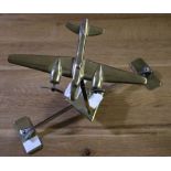 A brass model aircraft, (our vendor remembers that this was a gift to her farming family, in the Sec