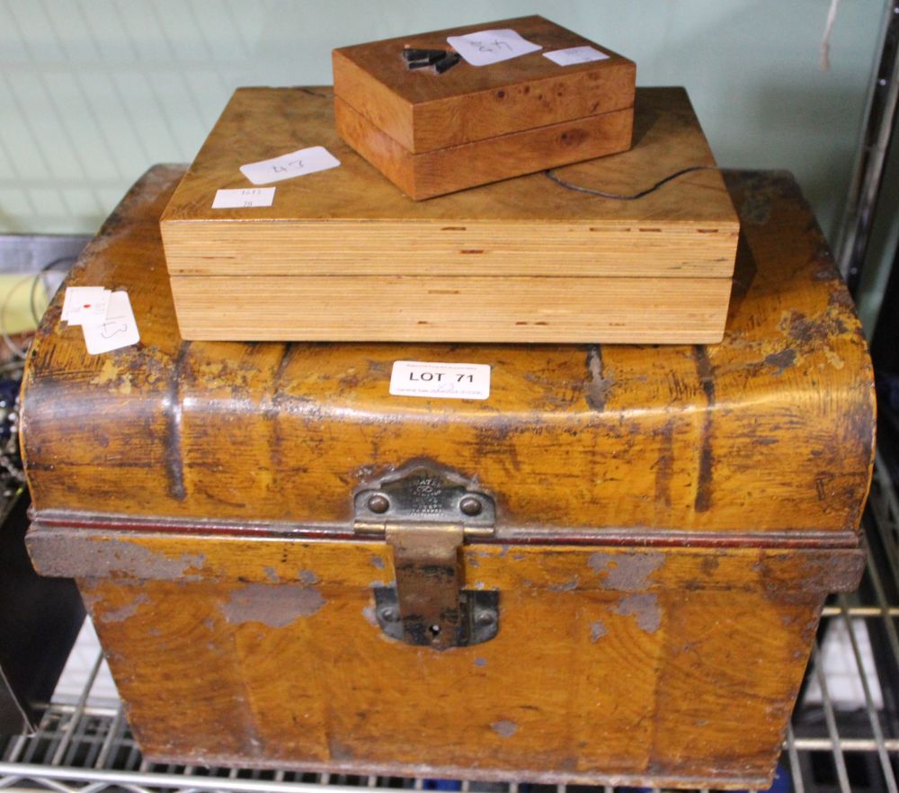 A small tin trunk with two wooden boxes