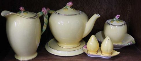 A collection of "Grimwades" Royal Winton ceramics, yellow ground, all but one piece with moulded ros