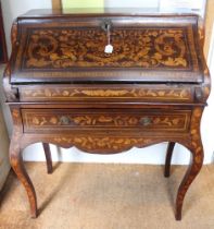 A 19th century Dutch design marquetry inlaid fall front bureau with fitted interior over drawer to b