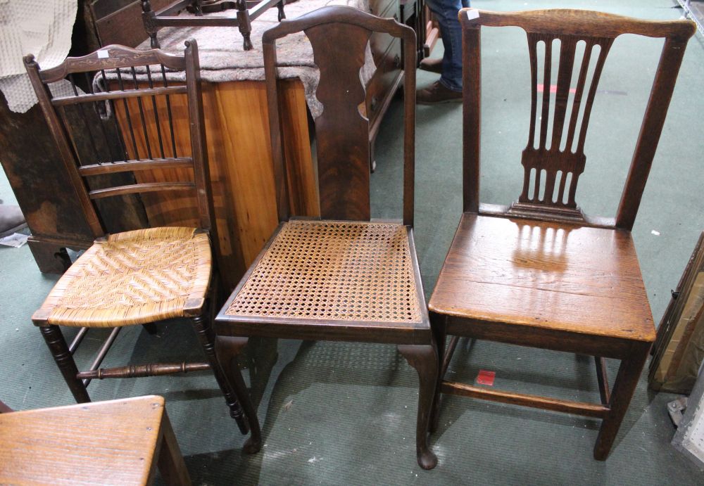 A 19th century solid seated oak country chair together two others bedroom style chairs