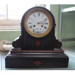 A 19th century black slate mantel clock, with key
