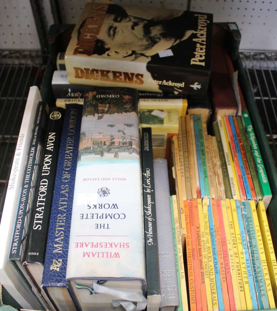 A box containing hard back books including vintage Ladybirds