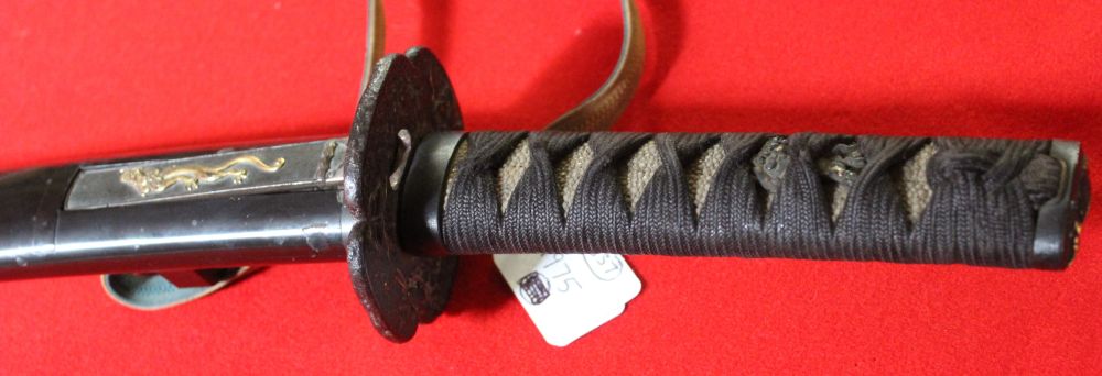 A Japanese sword with shagreen handle cord wrapped. Cast Tsuba. the lacquer scabbard inset small - Image 3 of 3