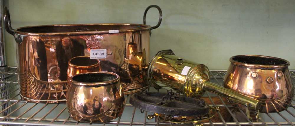 A copper two handled vessel, stamped "A Smith makers Stratford-upon-Avon, a brass clockwork spit eng