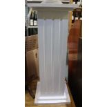 A white painted wooden plinth