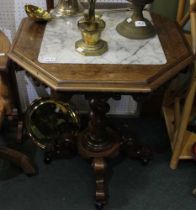 A late Victorian centre table, octagonal top marble inset, raised on barley twist stem and four shap
