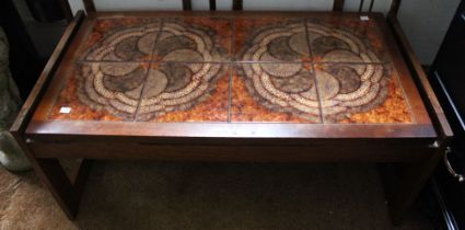 A mid-century teak tile topped coffee table