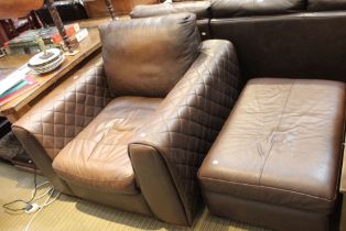 A modern large leather three seater sofa with a single arm chair and large foot stool