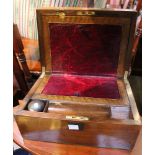 A 19th century mahogany writing slope, with internal pen tray and containing a turned Lignum ink wel