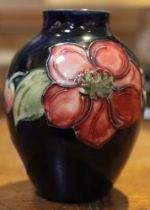 A Moorcroft vase, baluster form, tube lined and painted in Clematis pattern, factory marks to base 9