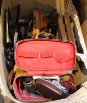 A box containing a selection of vintage items including a camera, wooden plane, cutlery etc