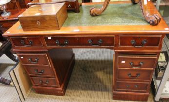 A twin pedestal desk with skiver top