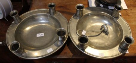 Kenneth Turner, a pair of American pewter shallow bowls, the broad rims fitted with four candle scon