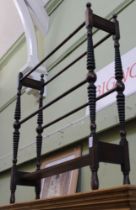 A Victorian mahogany towel rail with unusual turned tapering supports