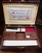 A 19th century rosewood needle work box, fitted interior includes sampler lined lid, the exterior li