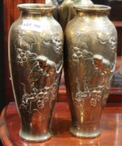 A pair of early 20th century Japanese brass vases, slender baluster form, embossed with mice amidst