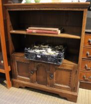 An Old Charm style open bookcase with cupboard below