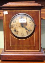 An early 20th century chiming mantel clock, the mahogany case with circular dial having Arabic numer