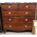 A 19th century chest of two over three drawers with brass drop handles on bracket feet