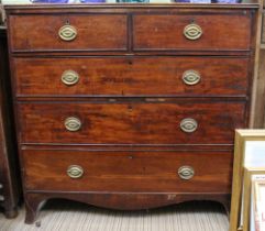 A 19th century chest of two over three drawers with brass drop handles on bracket feet