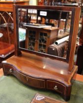 A 19th century mahogany dressing table mirror, serpentine box base, fitted three drawers, the centra