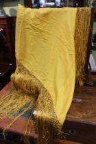 An early 20th century, Chinese Imperial yellow silk shawl, 104cm square, fringed
