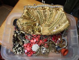 A plastic tray containing a selection of costume jewellery and a vintage style beaded bag
