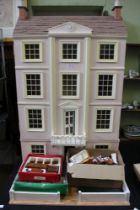 A two piece dolls house together with furniture