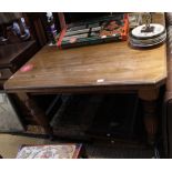 A 19th century wind out dining table on turned legs and casters two additional leaves