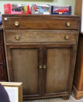A mid 20th century tall boy, two drawers over cupboard base