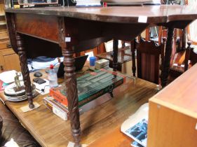 A mahogany twin flap breakfast table on leaf carved and turned legs with fancy edge top