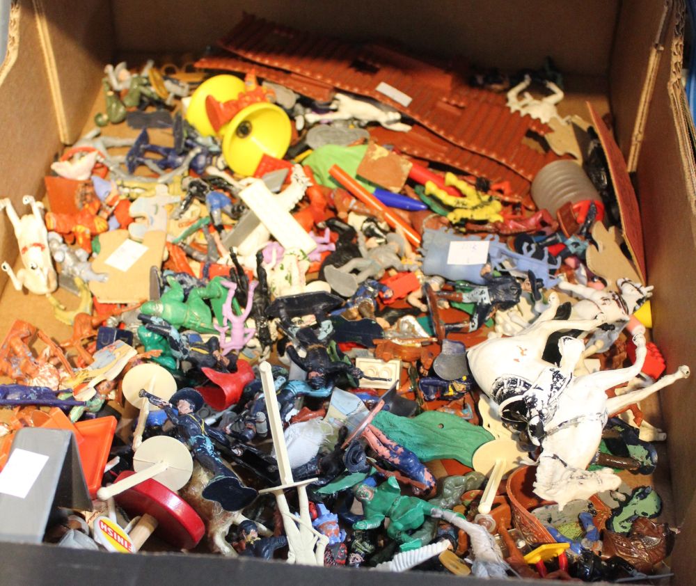 A box containing a wide selection of vintages children's plastic figures, etc