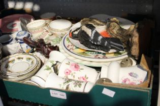A box containing a selection of china and porcelain including a woodpecker