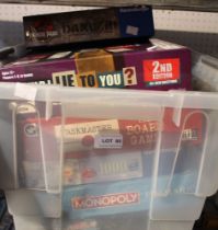 A box containing a good selection of board games