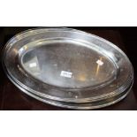 Eight oval stainless steel platters