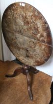 A Georgian burr elm topped circular tilt-top tripod table, upon oak base