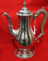 Garrard & co. A Georgian design silver coffee pot, teardrop form with cast acanthus leaf decoration
