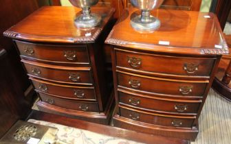 A pair of modern hard wood four drawer bedside chests