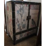 A cabinet, covered in Parrot print fabric