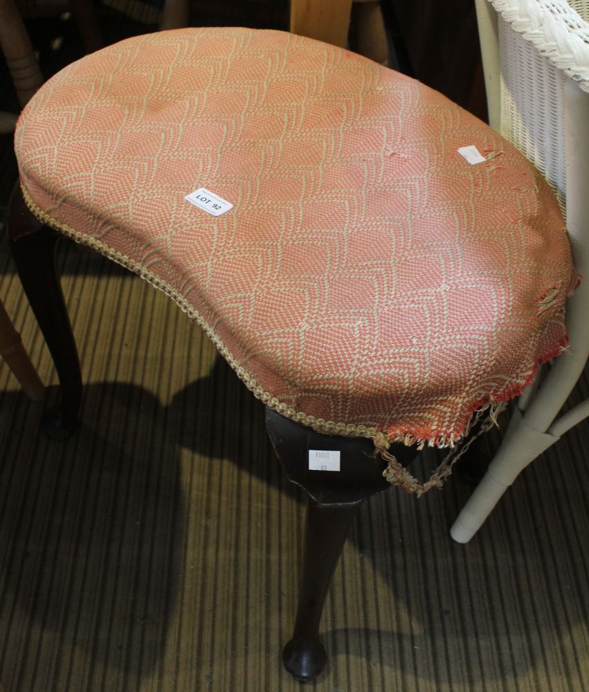 A 19th century kidney shaped dressing table stool on cabriole legs and upholstered top