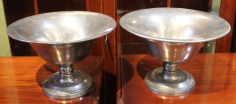 Kenneth Turner, a pair of American pewter fruit bowls, the flared rims, 27cm diameter on knop stems
