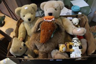 A box containing teddy bears and other toys