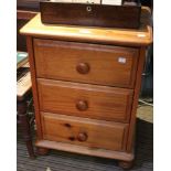 A small pine chest of three drawers