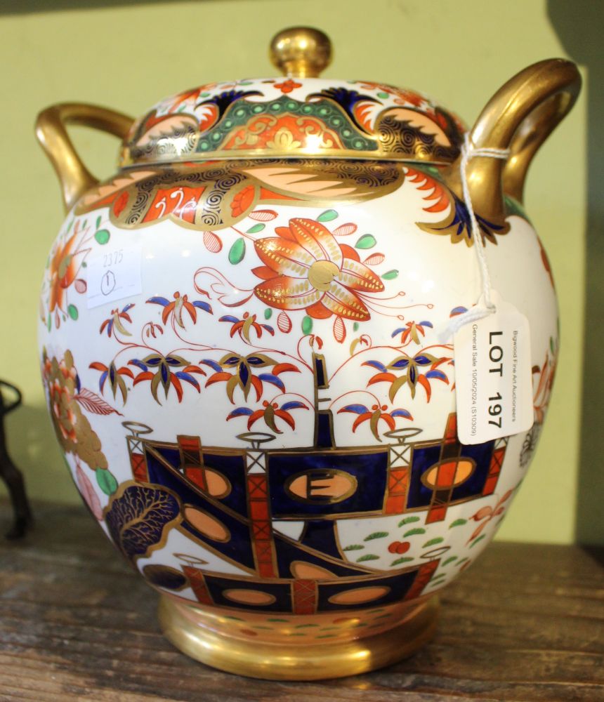 A 19th century Spode porcelain potpourri, fitted two gilded handles, painted and gilded in the Imari