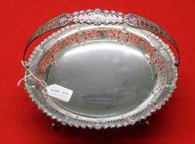 Mappin & Webb. A circular silver serving basket, cast bell husk rim, pierced decoration, fitted swin